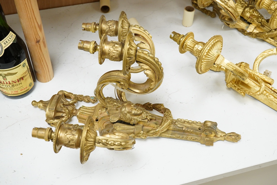 A pair of Adam style cast brass three branch wall sconces - 36cm high, with similar two branch sconce